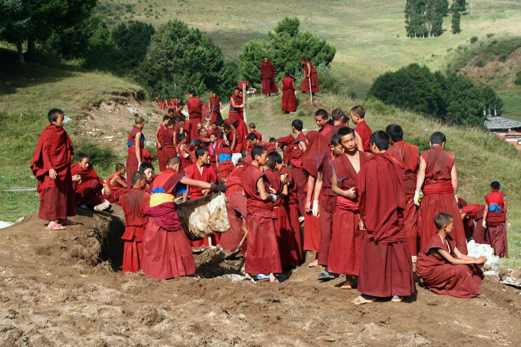 Xiahe Monks repair water supply system near Labrang Monestary, Gansu