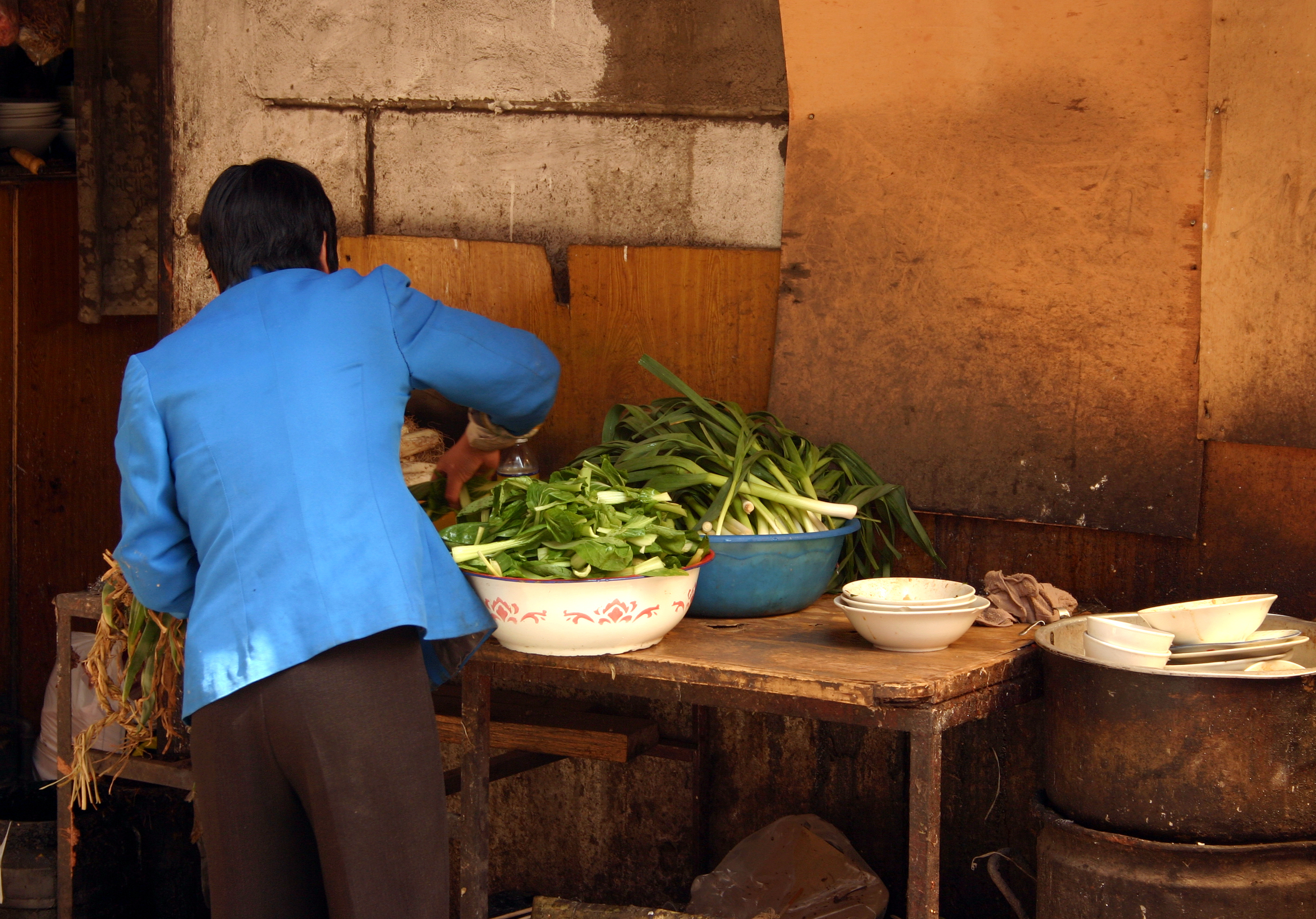women preparing food in shop, Lanzhou, Gansu